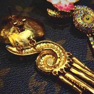 Back view showing handcrafted structure and gold finish