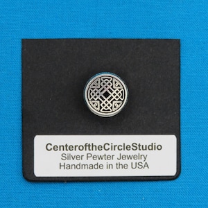May include: A silver pewter Celtic knot design button, on a black background with the text "CenteroftheCircleStudio Silver Pewter Jewelry Handmade in the USA".