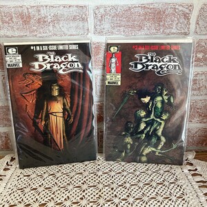 May include: Two comic books, "The Black Dragon", issues #1 and #2, in a six-issue limited series. The covers feature illustrations of characters in dark fantasy settings.