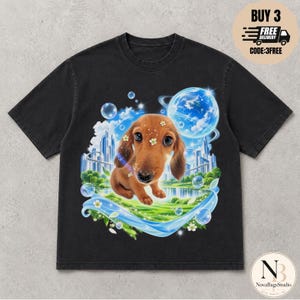 May include: A black short-sleeve t-shirt featuring a graphic print of a brown dachshund puppy surrounded by floating bubbles, small white flowers, a blue planet with rings, and a futuristic city skyline set against a green landscape.