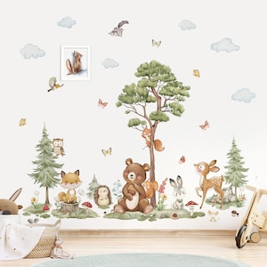 May include: A whimsical wall decal set featuring woodland creatures like a bear, fox, deer, and squirrel. The design includes trees, mushrooms, butterflies, and clouds, creating a charming forest scene. A framed picture of a squirrel is also included.