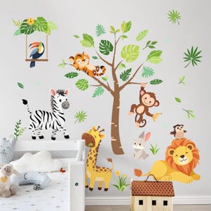 May include: A colorful wall decal set featuring jungle animals. Includes a zebra, giraffe, lion, monkey, tiger, toucan, owl, and rabbit. The tree and leaves are green and brown. The animals are in a cartoon style.