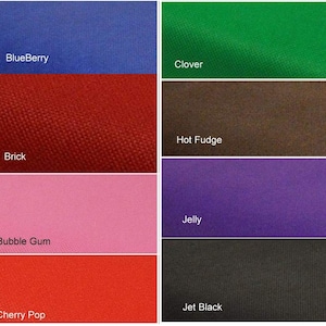 May include: A collection of six fabric swatches in various colors, including blueberry, clover, brick, bubble gum, cherry pop, and jet black. The swatches are arranged in two rows of three.