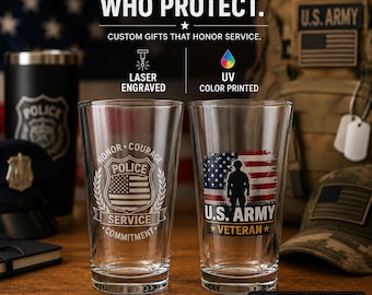 May include: Two clear glass pint glasses on a wooden surface. The left glass features a laser-engraved police badge with the text HONOR, COURAGE, SERVICE, COMMITMENT. The right glass displays a UV-printed U.S. Army Veteran graphic with a soldier silhouette.