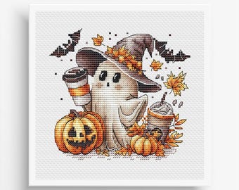 May include: Cross-stitch design featuring a friendly ghost wearing a witch hat, holding a coffee cup, and surrounded by pumpkins and fall leaves. Two bats are in the background. The design has a Halloween and autumn theme.