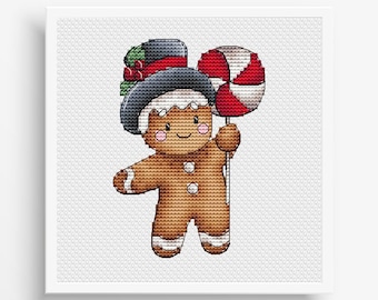 May include: A gingerbread man wearing a black top hat with green and red trim, holding a red and white candy cane.
