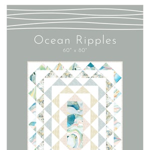 Può includere: Un modello di trapunta chiamato "Ocean Ripples" progettato da shell rummel & natalie crabtree. La trapunta misura 152,4 cm per 203,2 cm e presenta un design geometrico con tessuto in stile acquerello blu, verde e bianco.