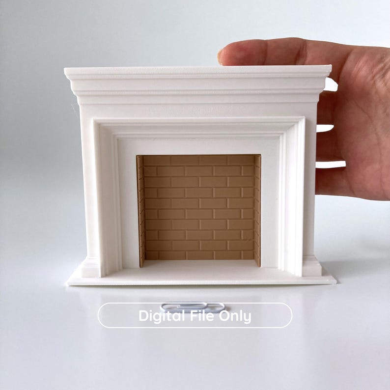 Puede incluir: Una chimenea blanca en miniatura con interior de ladrillo marr&oacute;n. La chimenea tiene un dise&ntilde;o cl&aacute;sico con molduras detalladas y una abertura rectangular. El texto "Digital File Only" se muestra en la parte inferior.