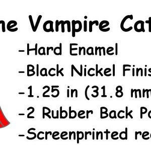 May include: A black and white cartoon vampire cat wearing a red cape and a black tuxedo. The cat has red eyes and fangs. The text "The Vampire Cat" is above the image. The text below the image describes the pin: "Hard Enamel", "Black Nickel Finish", "1.25 in (31.8 mm) in Length", "2 Rubber Back Posts", "Screenprinted red eyes/fangs".