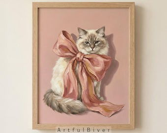 May include: A framed painting of a fluffy cat with a large pink bow. The cat has blue eyes and is set against a pink background. The text "Artful Biver" is at the bottom of the frame.