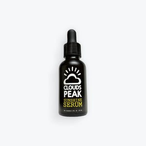 May include: A black glass bottle with a dropper top. The label says "Clouds Peak Sunshine Serum".