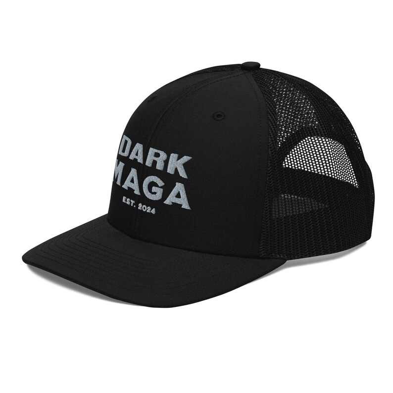 May include: Black trucker hat with a white embroidered logo that says "DARK MAGA EST. 2024".
