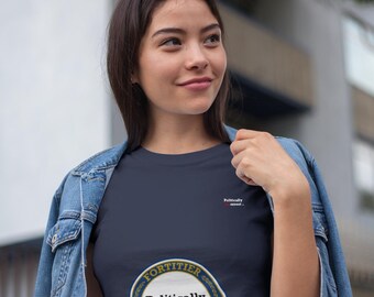 May include: A navy blue t-shirt with a gold and white circular graphic that says "Fortiter Verum Loqui" and "Politically Incorrect".