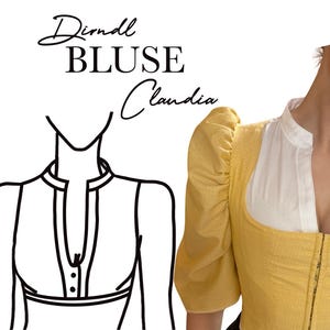 May include: A yellow dirndl blouse with white accents and puffed sleeves. The blouse has a high collar and a front zipper. The text "Dirndl BLUSE Claudia" is written in script above the blouse.