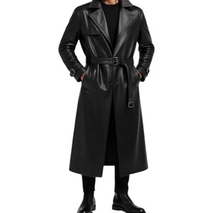 May include: A long, black leather trench coat with a belted waist and notched lapels. The coat is knee-length and has a classic trench coat design. The model is wearing black pants and boots.
