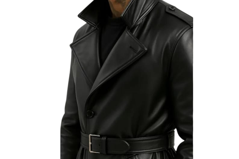 May include: Black leather trench coat with a notched collar, button closure, and a matching belt. The coat features a classic design with a sleek, polished appearance, suitable for various occasions.