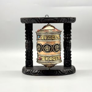 Handcrafted 8-Inch Tibetan Prayer Wheel – Wooden Base with Intricate Metal Design