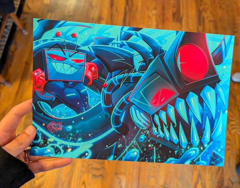 May include: A rectangular art print featuring a vibrant digital illustration of a television-headed character with red eyes and a wide grin, positioned next to a large, dark, mechanical creature with glowing red eyes and sharp blue teeth.