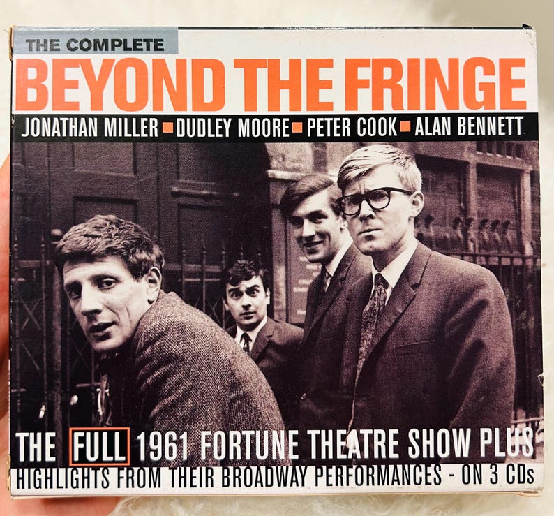 May include: CD case for "Beyond the Fringe" with Jonathan Miller, Dudley Moore, Peter Cook, and Alan Bennett. The cover displays a black and white photograph of the four performers. Text includes "The Complete" and "The Full 1961 Fortune Theatre Show Plus".