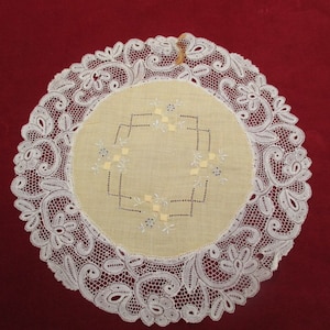 Antique embroidered lace doilie