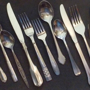 22 pc Mismatched stainless steel flatware service for 4 five pc place settings + serving spoon + another serving pc