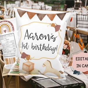 May include: A white chip bag with a brown, white, and orange design. The bag has a label that says "Aaron's 1st birthday!" and features a rocking horse, a stack of blocks, and a rainbow. The text "Editable in Canva" is on a pink background in the lower right corner of the image.
