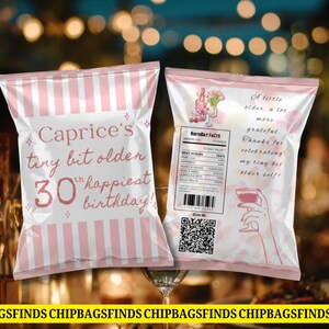 May include: Two pink and white striped chip bags with text that reads "Caprice's tiny bit older 30th happiest birthday!" and "A little older, a lot more grateful. Thanks for celebrating my tiny bit elder self!"