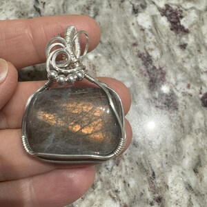Purple Labradorite wrapped in 925 Sterling Silver with a SS Beads