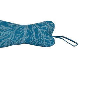 May include: Teal blue dog toy shaped like a bone with a white coral pattern and a white string attached.
