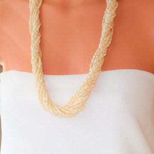 Vintage  Necklace . 12 Strands , Light weight faux Pearls. A stunning addition to your style .Day or Evening wear.Bridal. Gifts for women
