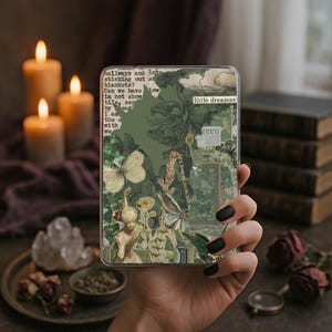 May include: A clear phone case held in a hand, featuring a collage design with green and beige botanical elements, butterflies, and text fragments. The case has a vintage aesthetic, with the words "little dreamer" and "reen" visible.