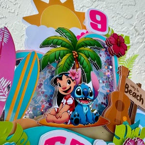 May include: A vibrant cake topper with Lilo and Stitch, a palm tree, and a ukulele. The design includes a pink number 9, a sign that says "Way to Beach", and the name "Emily" in pink letters. The background has a beach theme.