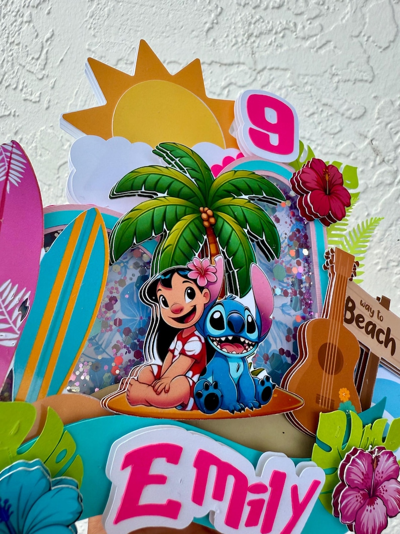 May include: A vibrant cake topper with Lilo and Stitch, a palm tree, and a ukulele. The design includes a pink number 9, a sign that says "Way to Beach", and the name "Emily" in pink letters. The background has a beach theme.