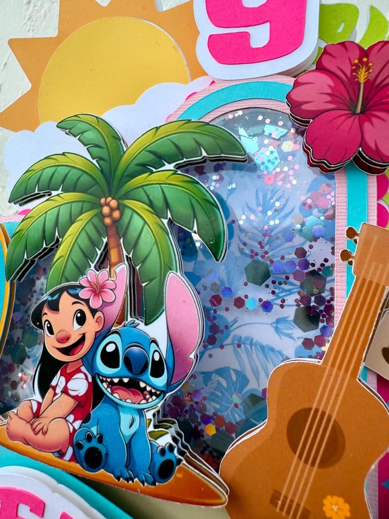 May include: A vibrant, layered papercraft featuring cartoon characters Lilo and Stitch, a palm tree, a ukulele, and a hibiscus flower. The design includes a sunny sky, a rainbow, and a shaker element with glitter. The overall theme is tropical and celebratory.