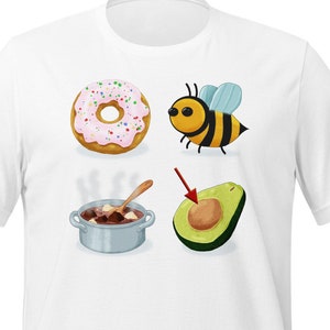 May include: A white t-shirt with four colorful illustrations: a pink and white donut, a yellow and black bee, a pot of brown stew, and a green avocado.
