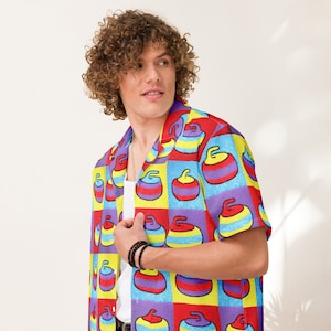 May include: A short-sleeved button-up shirt with a colorful pattern of curling stones. The shirt is made of a lightweight fabric and has a relaxed fit.