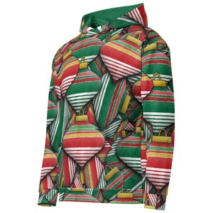 May include: A hooded sweatshirt featuring a repeating pattern of Christmas ornaments in red, green, and gold. The ornaments have striped and solid designs. The hood lining is green.