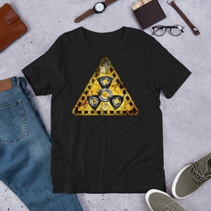 May include: Black t-shirt with a yellow and black warning sign featuring a stylized image of a spinning top. The sign has a distressed, vintage look.
