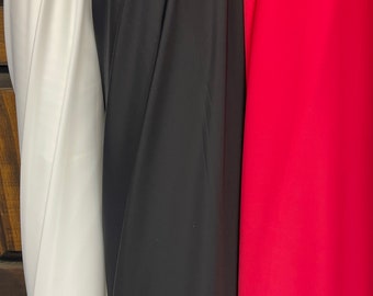 May include: Three fabric swatches, one white, one black, and one red.