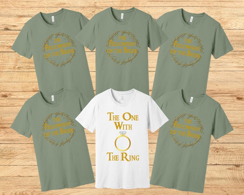 May include: Five green t-shirts with gold text and graphics. The shirts feature the text "The Fellowship of the Ring" and "The One With The Ring".