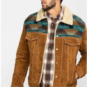 May include: A brown suede jacket with a sherpa collar and a patterned yoke. The yoke features a geometric design in shades of blue, brown, and white.
