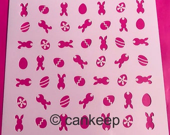 May include: A white plastic stencil with a pink background. The stencil features a repeating pattern of Easter-themed images, including bunnies, eggs, and flowers. The text "cankeep" is printed in the lower right corner.