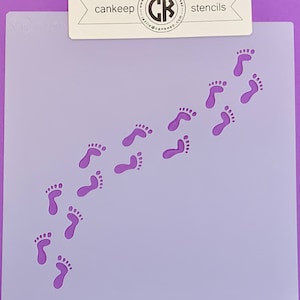 May include: A purple stencil featuring a footprint design. The stencil is set against a purple background. The text "cankeep stencils" is at the top of the stencil.