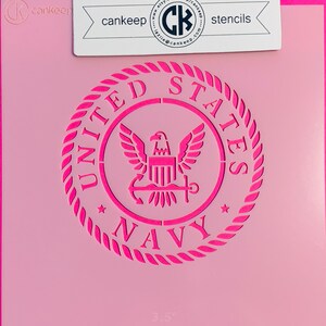 May include: A pink stencil of the United States Navy seal with the words "UNITED STATES NAVY" around the seal. The seal is 3.5 inches in diameter.