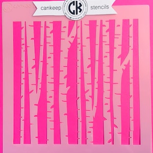 May include: A white plastic stencil with a design of a forest of trees. The stencil is on a pink background. The text "cankeep stencils" is on the top of the stencil.