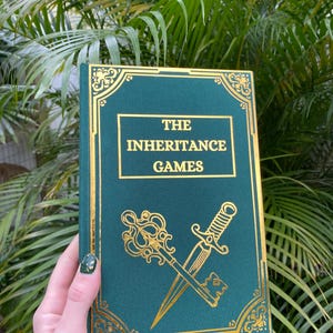 Handmade, Rebound Edition of The Inheritance Games by Jennifer Lynn Barnes.