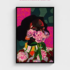 May include: A black framed canvas featuring a vibrant digital illustration of a person with dark hair, partially obscured by a cluster of pink peonies. The background displays bold magenta and dark green geometric patterns, with the text Black Framed Canvas.