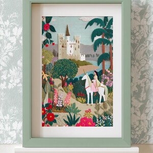 May include: Embroidered artwork in a green frame depicts a fairytale scene. A woman rides a white unicorn through a colorful garden, with a castle in the background. The artwork is filled with vibrant flowers and lush greenery.