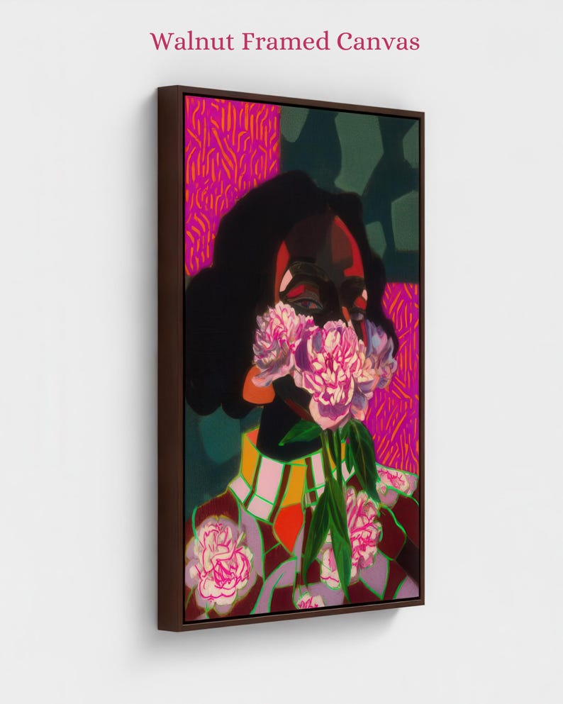 May include: A vertical rectangular canvas print titled Walnut Framed Canvas, featuring a stylized portrait of a figure with dark skin, obscured by a bouquet of pink peonies. The background displays vibrant magenta and dark green geometric patterns.