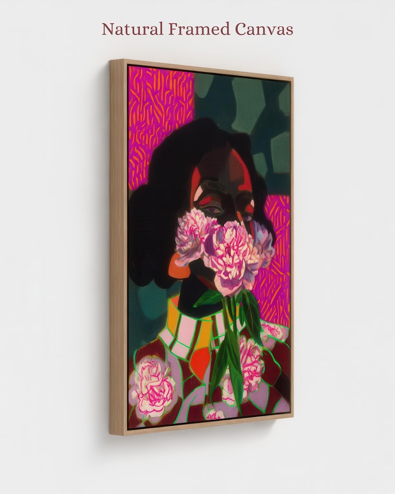 May include: A natural framed canvas featuring a vibrant painting of a figure with dark skin holding a bouquet of pink peonies over their face. The artwork includes bold patterns in magenta, dark green, and yellow, with a light wood frame border.